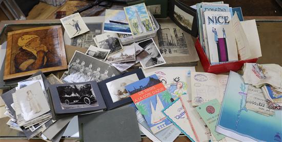 A collection of Cunard menus, photo albums and topographical world albums